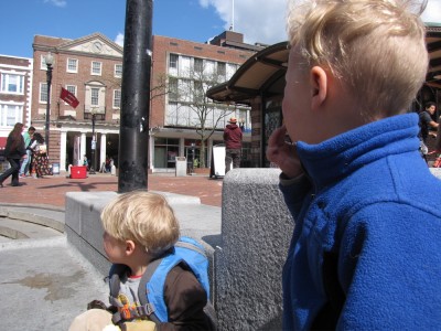 Zion and Lijah snacking in the middle of Harvard Square