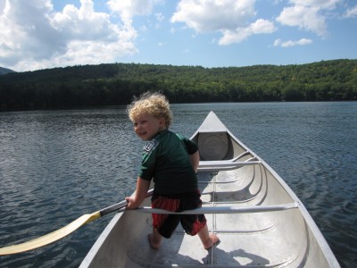 Harvey at the bow of the canoe on the lake