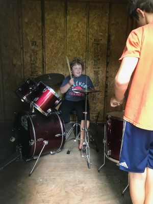 Harvey playing drums in the Jacksons' shed