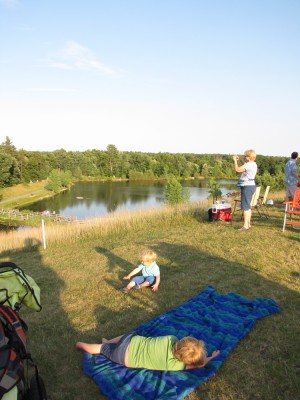 our concert-watching spot, with pond down the hill behind