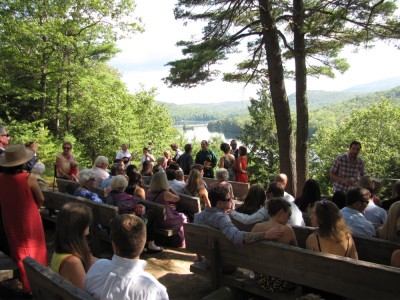 the view down to the lake over the heads of the wedding audience