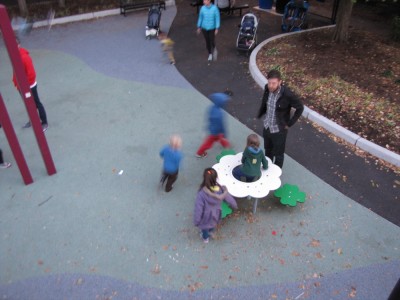 Harvey and Zion, seen from above, running on the playground