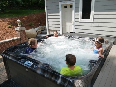 the boys in a hot tub with friends
