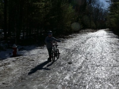 Harvey walking his bike over the icy icy path