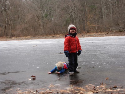 Harvey standing, Zion fallen down on the ice