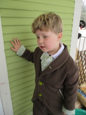 Harvey in his Easter suit leaning against the wall of the house