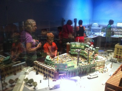 Grandma Judy and Harvey looking at Fenway Park rendered in Legos