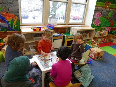 Lijah playing Candyland with friends at the Chelmsford library