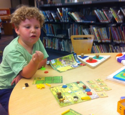 Harvey and Agricola in the kids room at the library