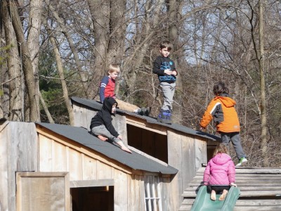 Lijah and four friends on the roof of the playhouse