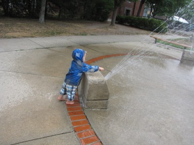 Lijah carefully poking at the fountain with a stick