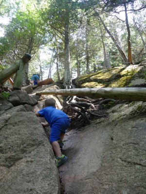 Lijah climbing up a steep part of the trail up Pemetic