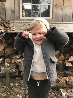 Lijah by the woodpile