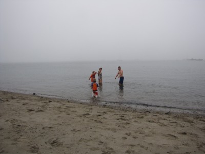 four of us in the water at foggy Lincolnville beach