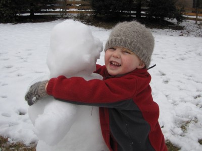 Harvey hugging his snowman