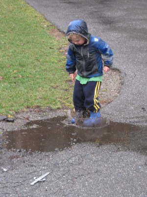 Zion jumping in a puddle