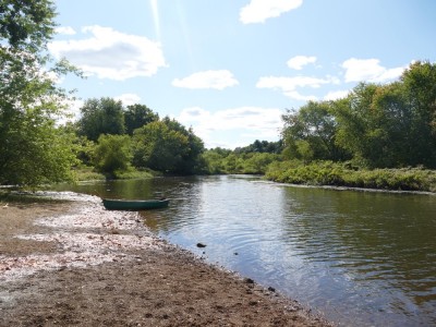 the canoe pulled up on a beach on the Sudbury River