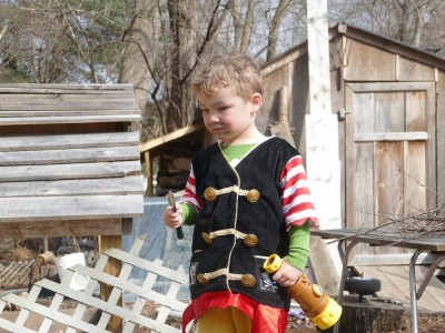 Lijah in the yard in his pirate costume