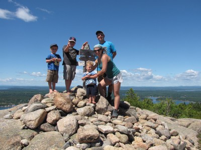 the Archibalds posing atop Parkman Mtn