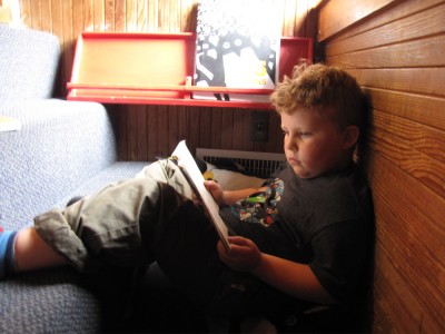 Harvey reading a book at the Childrens Discovery Museum