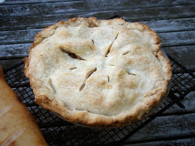 an apple pie cooling on the porch