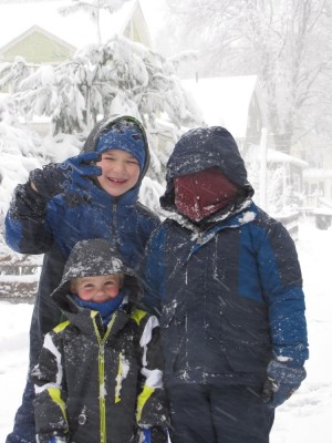 Harvey, Zion, and a friend posing in the snow