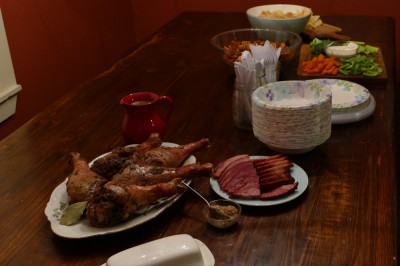 turkey drumsticks and other food on the table