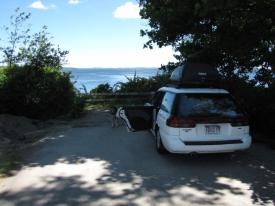 the car parked at a dead-end facing the ocean