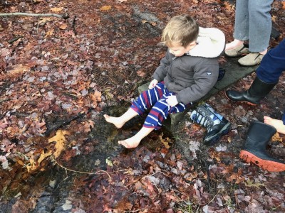 Lijah dipping his feet in a tiny stream