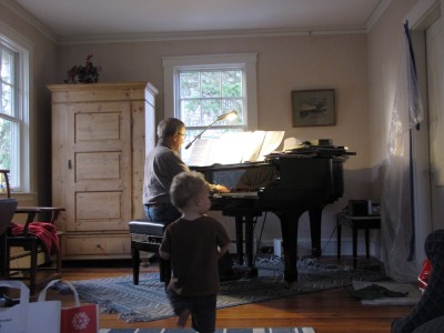 Grandpa playing the piano, Lijah dancing along