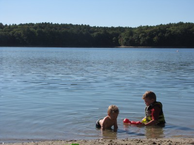Harvey and Lijah in the water at Walden Pond