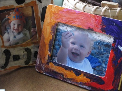 baby Harvey and Zion smiling from the frames the big boys decorated