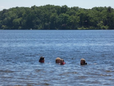 kids swimming way out in the water at Freeman Lake