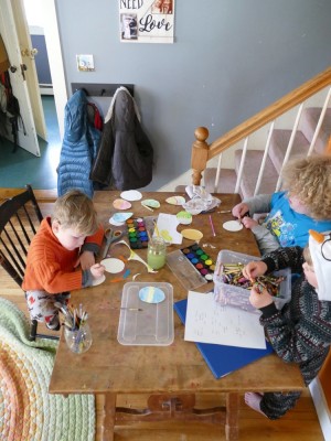 the boys creating paper easter eggs