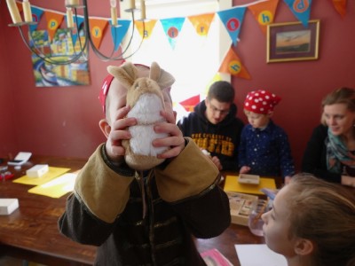 Lijah showing off a new stuffed mouse at his birthday party
