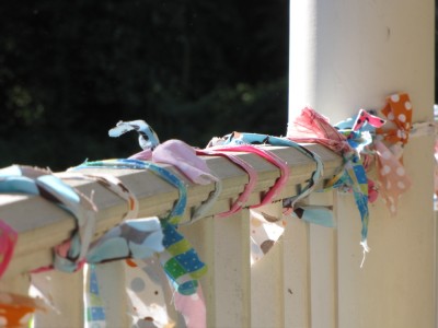 colorful fabric wrapped around the porch railing