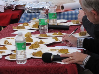 many pieces of pumpkin pie in front of the judges