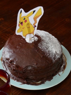 a chocolate cake with a pikachu on top
