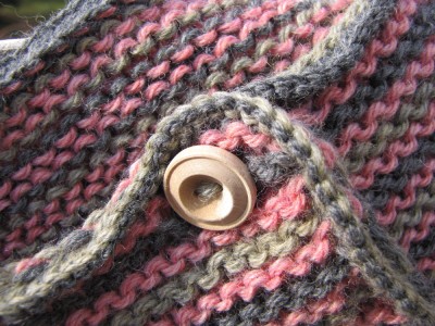 close-up of the pink and gray and green sweater