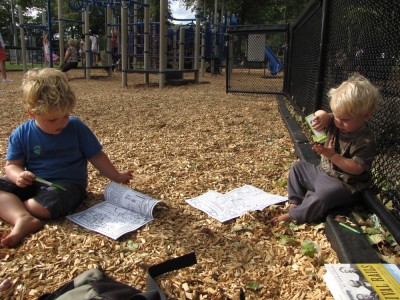 Harvey and Zion drawing in the playground