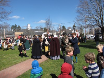 the kids looking at lots of reenactors on the common