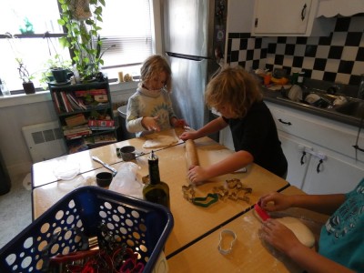 Zion and Elijah making salt dough ornaments in a friend's kitchen