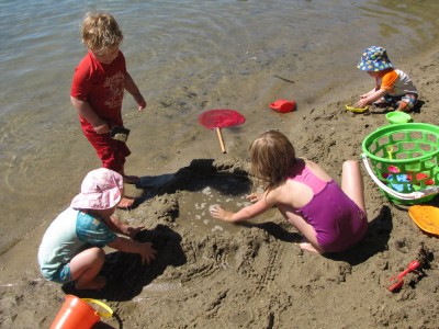 the kids working on their sand structure, a raised pool