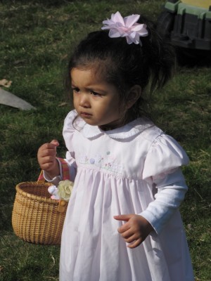 Kamilah looking serious holding her basket