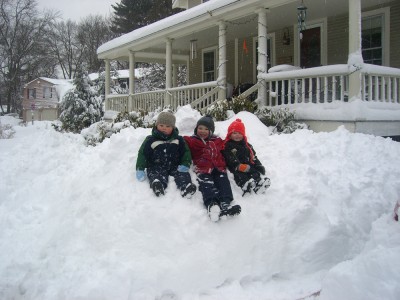 the neighborhood boys on a snowbank