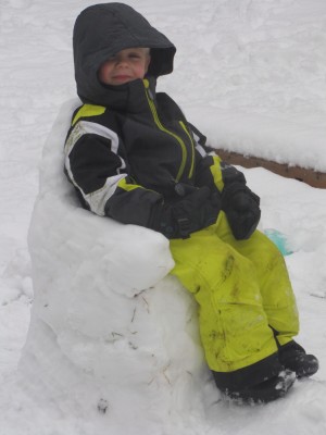 zion sitting in a snow chair