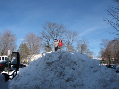 Harvey and Zion atop a giant mound of snow