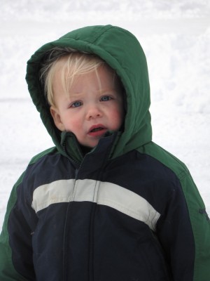 Zion looking nonplussed in his snow jacket hood