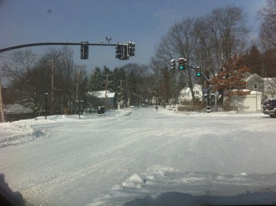 the intersection of South Road and Railroad Ave, with snow covering the pavement