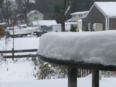 snow piled on the table on the back porch
